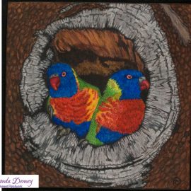 A colorful bird painted inside a tree hollow.